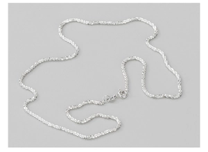 Close-up of sparkling S925 sterling silver chain with highly reflective sandblasted finish