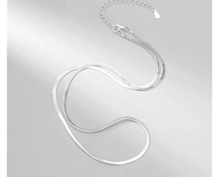Close-up of S925 sterling silver herringbone chain with lobster clasp and extension