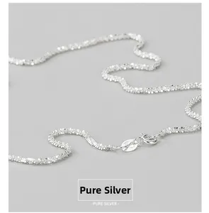 Detailed macro of the S925 ITALY hallmark on a sparkling silver necklace chain