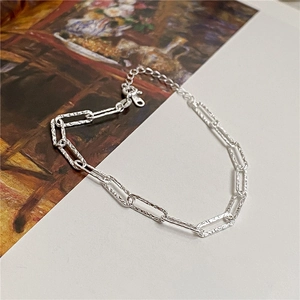 Detail of S925 sterling silver paperclip bracelet with textured link and lobster clasp