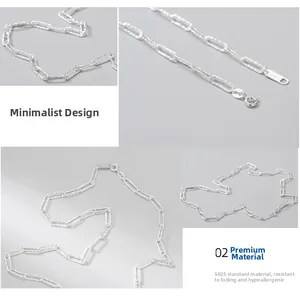 Macro detail of S925 sterling silver paperclip chain with shimmering textured finish