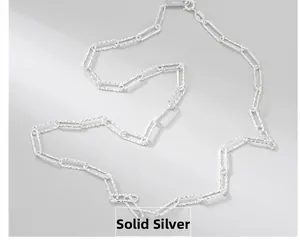 Macro detail of S925 sterling silver box chain necklace with shimmering hammered texture