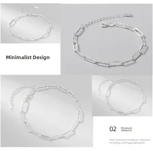 Macro detail of S925 sterling silver chain links with brushed texture and lobster clasp
