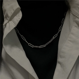 Detail of S925 sterling silver paperclip chain with shimmering textured finish