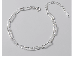 Macro detail of S925 sterling silver rectangular links bracelet with Italy hallmark