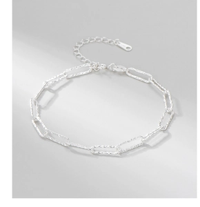 Detailed macro view of S925 sterling silver square link chain bracelet with lobster clasp