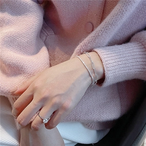 Sparkling S925 sterling silver layered paperclip bracelet and solitaire ring on model