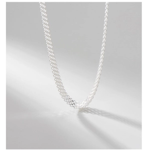 Macro shot of 925 sterling silver woven mesh chain showing intricate texture detail