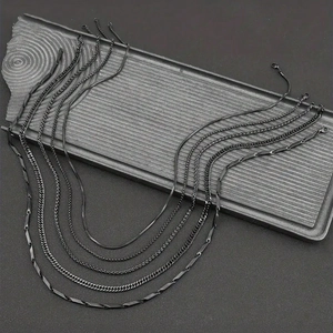 Five-piece set of matte black stainless steel necklaces with various textures for men