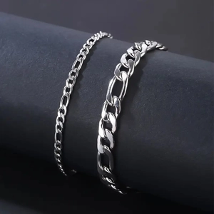 Detail of silver stainless steel Figaro chains in 4mm and 8mm with mirror polished finish