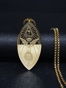 Detailed macro view of Ordo Temples Orientis pendant with gold engraved mystic symbols