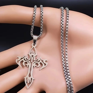Close-up of stainless steel tribal hollow cross pendant with a classic box chain