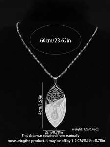 Macro detail of silver Ordo Templi Orientis pendant with Eye of Providence and dove engraving