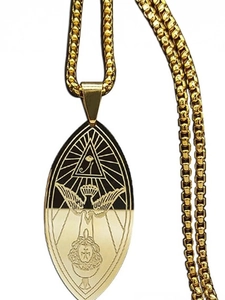 Detailed macro view of the gold Eye of Providence pendant with intricate wing carvings
