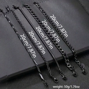 Detail view of five different black metal chain bracelets including cuban and rope styles
