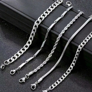 Detail view of 5-piece silver stainless steel bracelet set with diverse chain textures