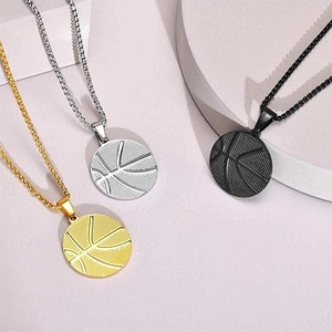 Three basketball pendants in gold, silver, and black finish on geometric steps