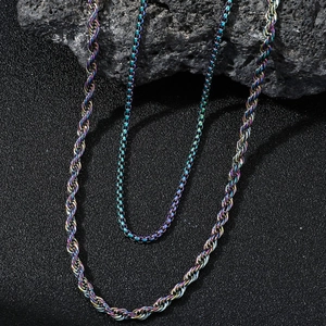 Rainbow plated stainless steel dragon bone and box chain necklaces on volcanic rock