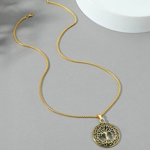 Golden Celtic Tree of Life pendant necklace with black vintage details on white display