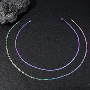 Macro detail of rainbow plated curb and snake chains with vibrant gradient finish