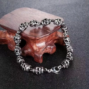 Punk style silver skull link bracelet for men with secure lobster clasp and gothic design