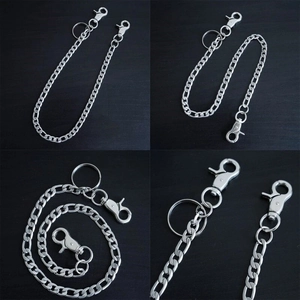 Detail of 50cm silver punk trousers chain with lobster clasps and key ring on black wood