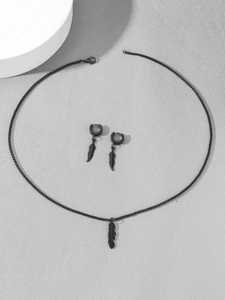 Detail of 3-piece black plated feather jewelry set with necklace and drop earrings