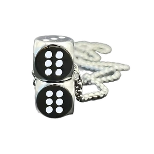 Polished silver dice pendant necklace with minimalist metal chain on white background