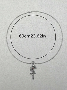 Detailed view of dragon and sword pendant with red stone on a 60cm silver bead chain