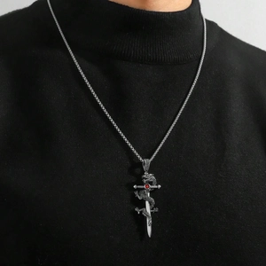 Silver dragon sword pendant with red gemstone and stainless steel chain on male model