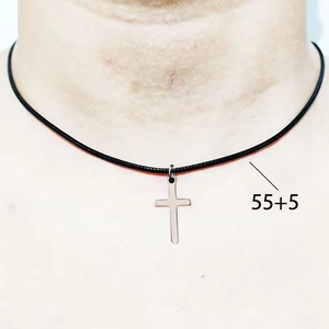 Close-up of gothic cross necklace with 55+5cm adjustable black cord on model neck