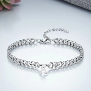Silver Cuban chain bracelet featuring a polished letter A pendant and lobster clasp closure