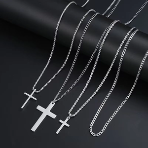 Macro view of stainless steel cross pendants with diverse box, twist and Cuban chains
