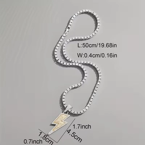 Two-tone lightning bolt pendant necklace with tennis chain and pavé zircon stones