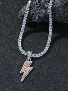 Close-up of hip-hop lightning bolt pendant with pink zircons and tennis chain detail