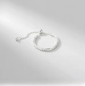 Detailed macro view of S925 sterling silver adjustable soft chain ring with shimmering beads