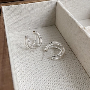 Minimalist S925 sterling silver triple-layer C-shaped stud earrings in a wooden jewelry box