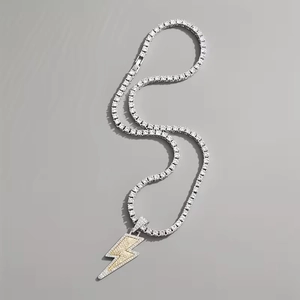 Hip hop two-tone lightning bolt pendant on iced-out tennis chain with white zircons