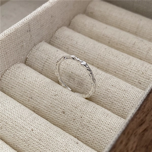 S925 sterling silver minimalist ring with crinkled tin foil texture on beige velvet box