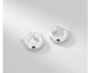 Detailed view of S925 sterling silver chunky hoop earrings with high polish finish