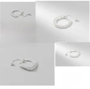 Detail of S925 sterling silver triple-layer beaded stretch chain ring with hanging bead
