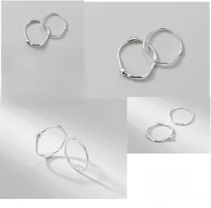 Detailed macro of S925 sterling silver rings with irregular liquid lava texture