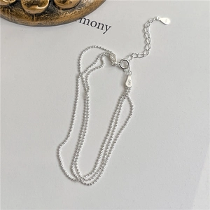 Detail view of S925 sterling silver three-layer beaded bracelet with hallmark tag