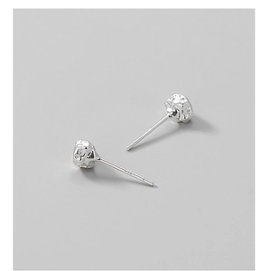 Detailed close-up of S925 sterling silver earrings with irregular hammered texture