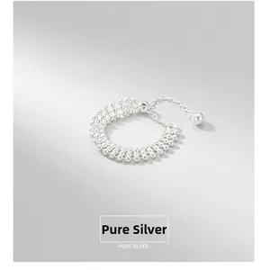 Macro detail of S925 pure silver multi-layer beaded ring with adjustable chain link