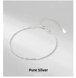 Detail of adjustable S925 sterling silver beaded bracelet with square cut link texture