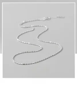 Detailed view of an S925 pure silver beaded chain necklace with sparkling square facets