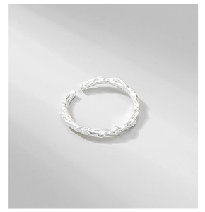 Macro detail of S925 sterling silver ring featuring unique crushed foil ripple texture