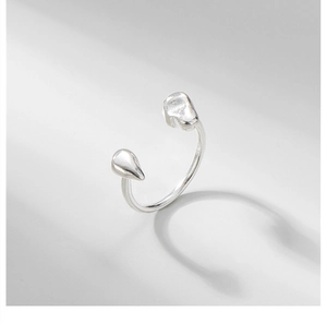 Macro shot of S925 sterling silver floating ring with molten lava droplets design