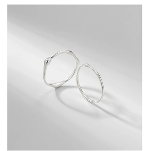 Detailed view of S925 sterling silver rings with irregular liquid texture and thin lines